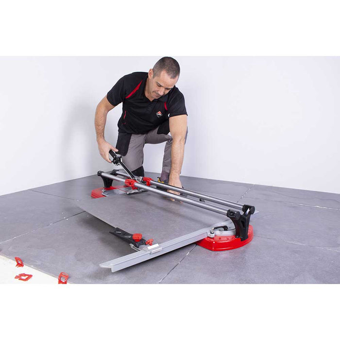 Cutting a piece of large format porcelain tile with Rubi Tools TX-MAX Tile Cutter
