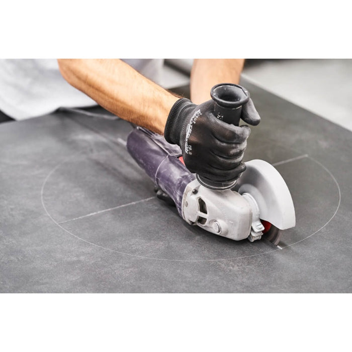 Angle grinder to cut cloves into porcelain sheets for circular cut-outs