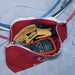 Electrician holding test and measurement equipment in Klein red canvas bag