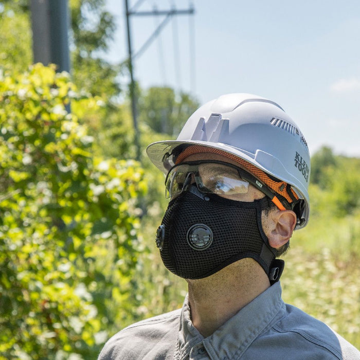 Man wearing Klein Tools Reusable Face Mask with hard hat and glasses