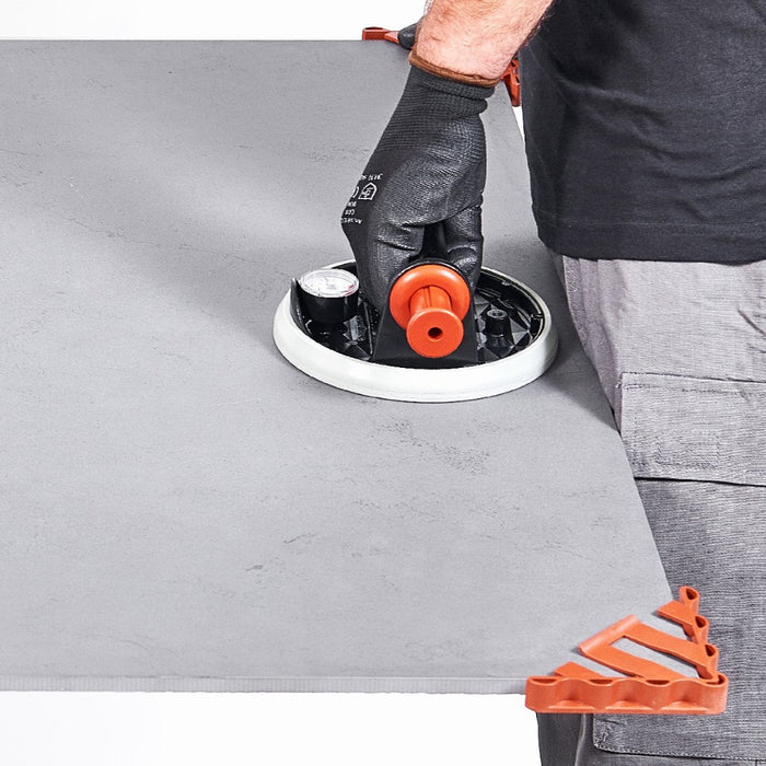 Moving thin panel porcelain tile with vacuum suction cups and corner protection