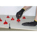 Close up of Rubi Tools CYCLONE Tile Leveling System installation for flat tile
