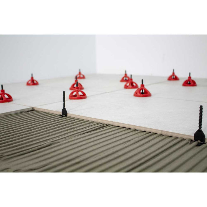 Rubi Tools CYCLONE Tile Leveling System bases embedded into thinset for level install