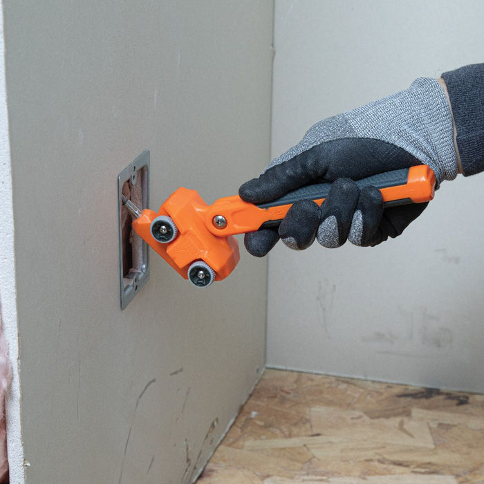 Grabbing wire inside of the wall with Klein Tools Magnetic Wire Puller