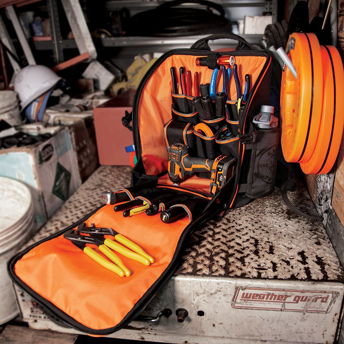 Tradesman Pro™ Tool Station Backpack opened in the back of a work van, filled with tools