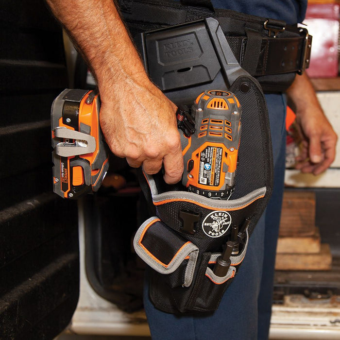 Removing the drill from Tradesman Pro™ Modular Drill Pouch