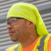Contractor wearing High-Visibility Yellow Cooling Band on job site