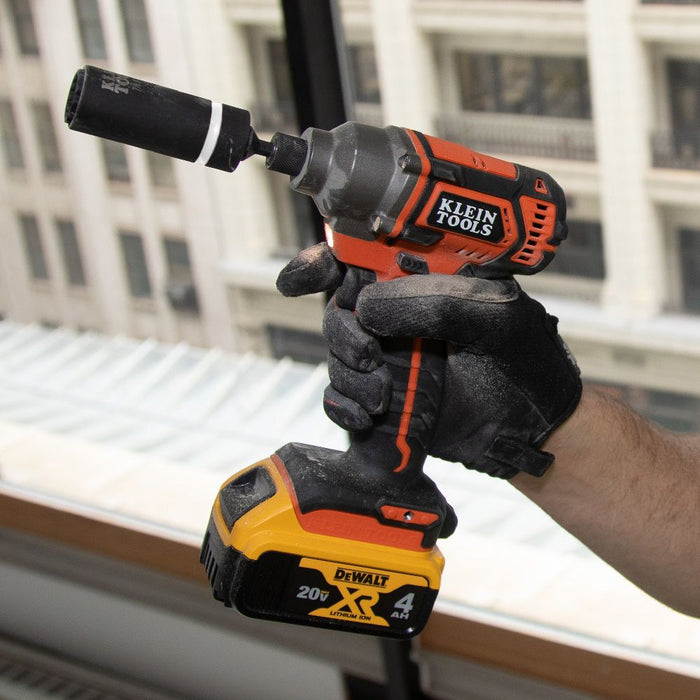 Contractor holding Klein Tools Impact driver with 2-in-1 socket attached