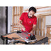 Cutting tile with Rubi Tools TS series cutter on work table, 66924