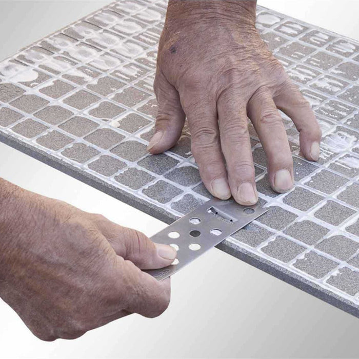 Rai-fix hooks placed into notch on back of porcelain tile