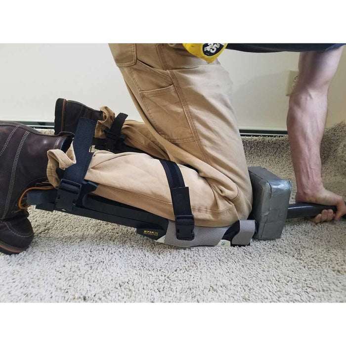 Installing carpet with knee kicker, wearing ProKnee 0714 knee pads with straps below the knee