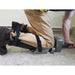 Installing carpet with knee kicker, wearing ProKnee 0714 knee pads with straps below the knee