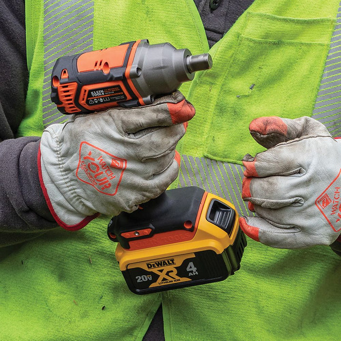 Contractor holding Klein Tools Impact Wrench with gloves