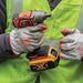 Contractor holding Klein Tools Impact Wrench with gloves