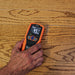 Reading the moisture level of a wood panel floor