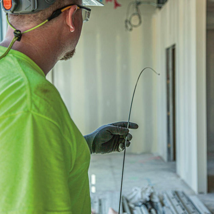 Extended Klein Tools Steel Fish Tape on jobsite