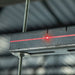 Red laser projected on metal frame