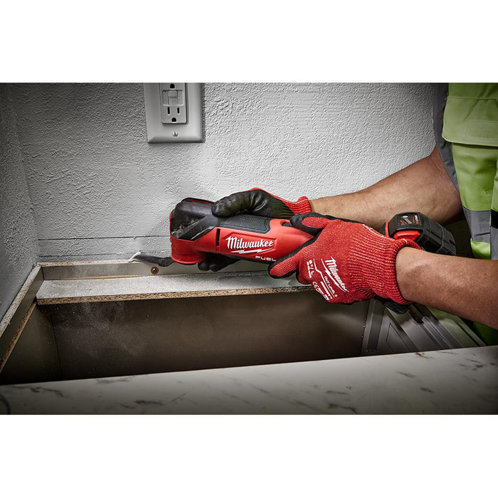 Cutting walls for countertop framing with Milwaukee M18 FUEL™ Oscillating Multi-Tool