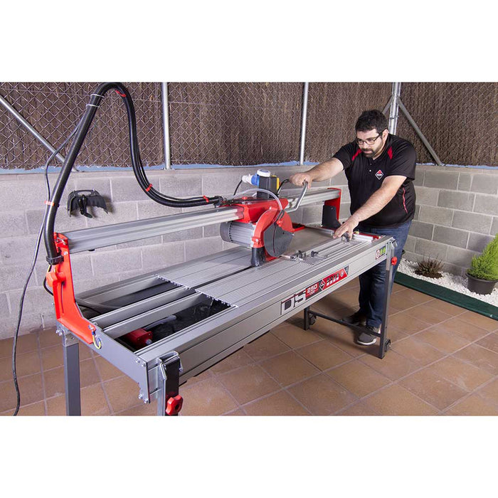 Professional contractor using Rubi Tools DS-250 N Rail Saw cutting tile